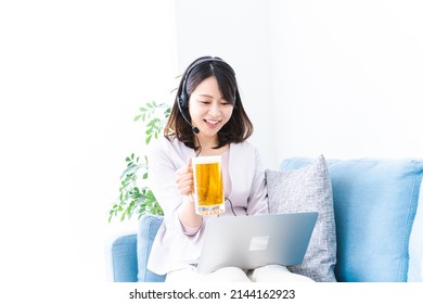 Young Woman Making A Toast At An Online Drinking Party