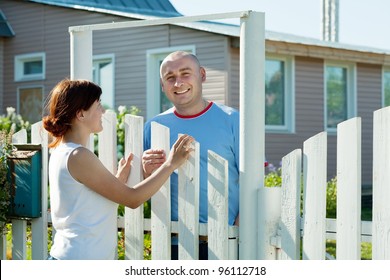  Young Woman And Man Near Fence Wicket