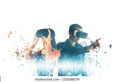 A young woman and a young man in virtual reality glasses are fragmented into pixels.The concept of modern technologies and technologies of the future. VR glasses.