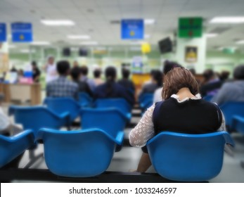 young woman and many people waiting medical and health services to the hospital,patients waiting treatment at the hospital,blurred image of people - Powered by Shutterstock