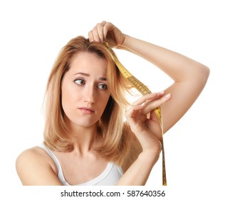 Young Woman Measuring Hair Length On White Background