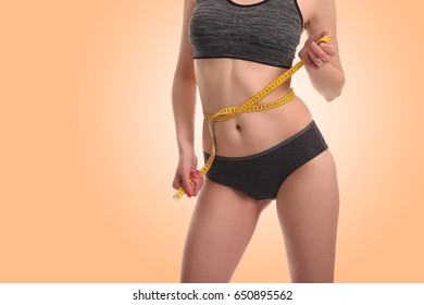 Young Woman Measuring Waist. Healthy Lifestyle, Losing Weight