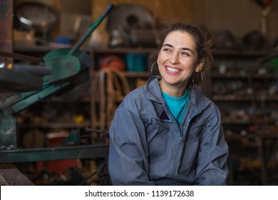 Young Woman Mechanic In A Workshop
