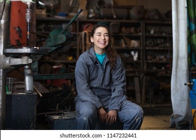 Young Woman Mechanic In A Workshop
