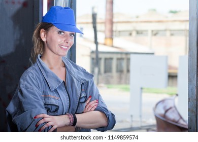 young woman mechanic in a workshop - Shutterstock ID 1149859574