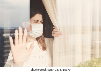 Young woman in medical mask stay isolation at home for self quarantine. Concept home quarantine, prevention COVID-19, Coronavirus outbreak situation
