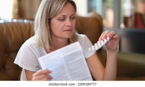 Young Woman With Medicines And Pills. Sick Woman Looking At Medication Explanation Before Taking Prescription Medication