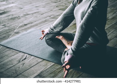 Young woman meditates while practicing yoga. Freedom concept. Calmness and relax, woman happiness. Toned picture - Shutterstock ID 414277981