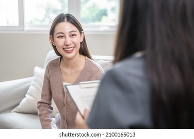 Young Woman In A Mental Therapy Session Talking With A Psychologist In The Office.