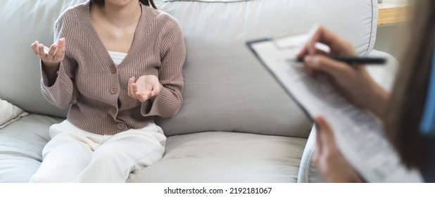 Young Woman In A Mental Therapy Session Talking With A Psychologist In The Office.