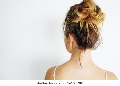 Young Woman With Messy Bun Hairstyle.