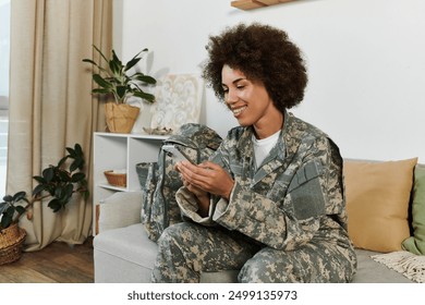 A young woman in military attire smiles as she connects with loved ones before her deployment. - Powered by Shutterstock