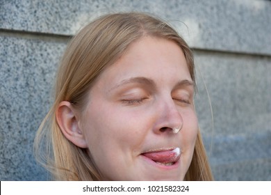 Young Woman With Milk Foam On Nose And Tongue - Victoria, Canada