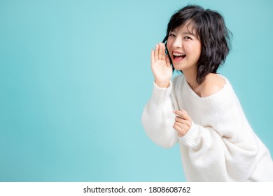 Young Woman Model With Speaking Gesture, Isolated On Blue Background