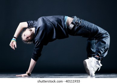 Young Woman Modern Dance. On Dark Background.