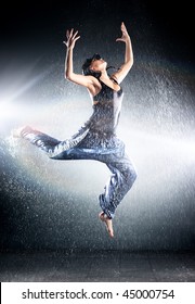 Young woman modern dance. Water studio photo.