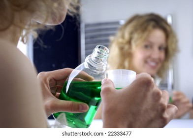 Young Woman With Mouthwash