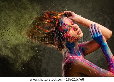 Young woman muse with creative body art and hairdo 