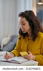 Young Woman In A Mustard Shirt Looking Busy