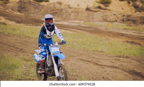 Young Woman Mx Biker - Motocross Racer On Dirt Bike At Sport Track