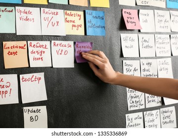 Young Woman Near Scrum Task Board In Office