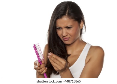 Young Woman Is Nervous About Hair Loss