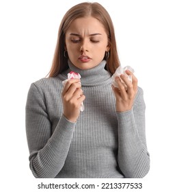 Young Woman With Nosebleed And Tissue On White Background