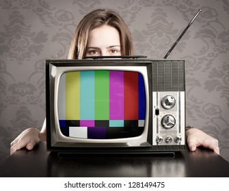 Young Woman With Old Retro Tv