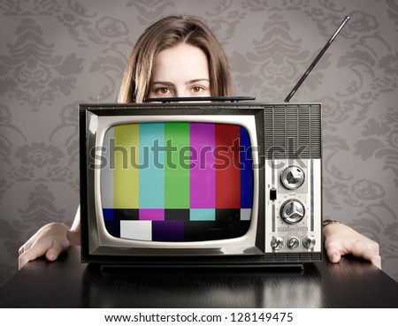 young woman with old retro tv