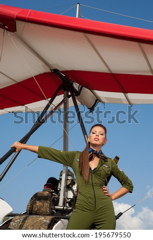 young woman on the background of a hang glider