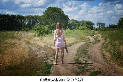 Young Woman On A Crossroad