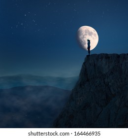 Young Woman On Edge Of The Cliff Towards The Moon