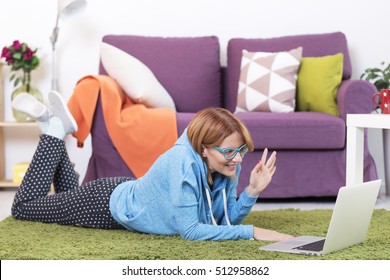 Young Woman On The Floor With Lap Top Computer