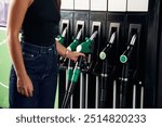 Young woman on the gas station.