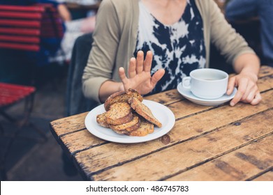 Young Woman On Gluten Free Diet Is Saying No Thanks To Toast In A Cafe