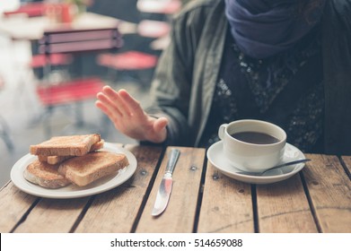 A Young Woman On Gluten Free Diet Is Saying No Thanks To Bread In A Cafe