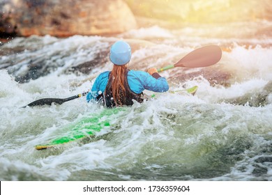 Young Woman On Kayak With Spray Paddle. Concept Travel Summer Day.