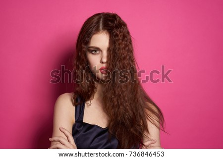 young woman on a pink background                               