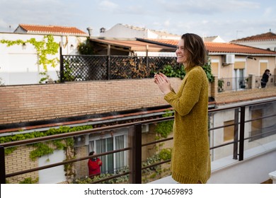 Young Woman On Quarantine Applauding To Support Health Workers