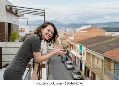 Young Woman On Quarantine Applauding To Support Health Workers