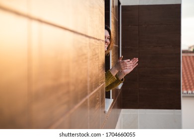 Young Woman On Quarantine Applauding To Support Health Workers