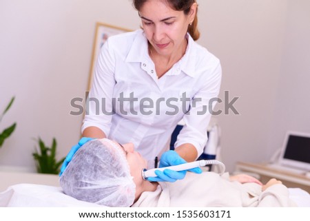 Similar – Female doctor giving medication to elderly patient