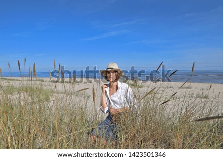 Similar – Young woman and Labrador at the Baltic Sea beach