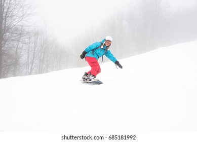 Young Woman On The Snowboard