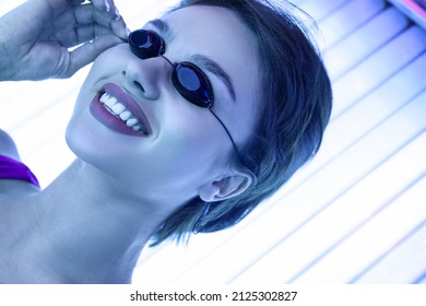 Young Woman On Sunbed In Beauty Salon