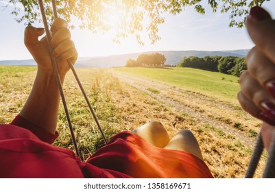 young woman on a swing. Point of view shot. 