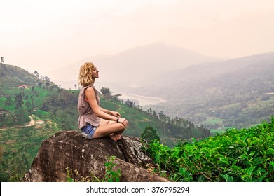 Young woman on tea plantation and beautiful view. Srilanka - Shutterstock ID 376795294