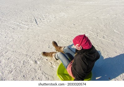 Young Woman On Toboggan Pad