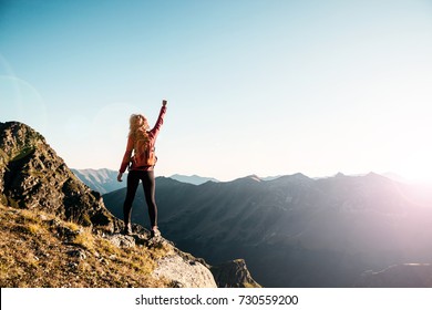 Young woman on the top in the caucasus mountains