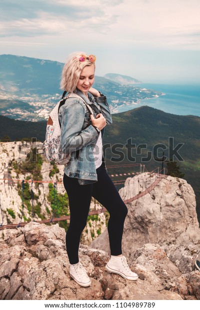 Young\
woman on the top of mountain. Ai-Petri,\
Crimea